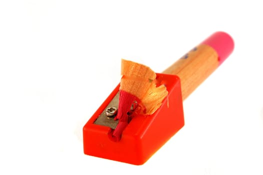 Pencil with shaving, red plastic sharpener
