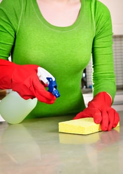 Girl cleaning kitchen
