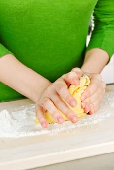 Hands kneading dough