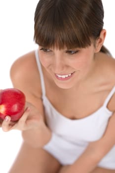 Female teenager eat apple for breakfast