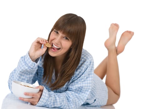Female teenager eat healthy  cereal for breakfast