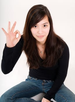 sitting with OK sign