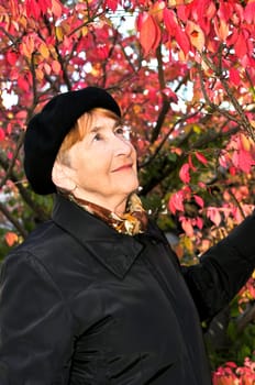 Senior woman in fall park