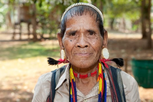 Portrait of old man with earrings