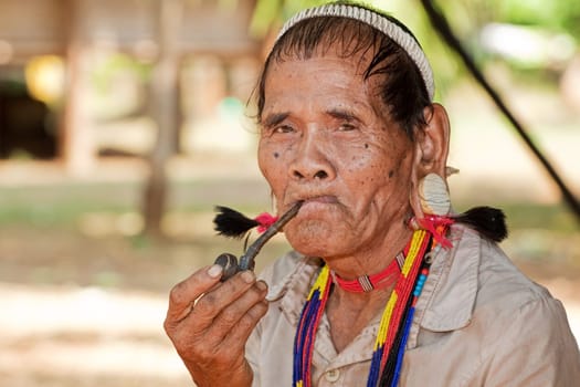 Portrait of old man with pipe