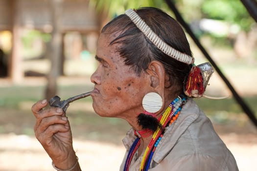 Portrait of old man with pipe
