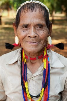 Portrait of old man with earrings