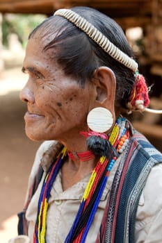 Portrait of old man with earrings