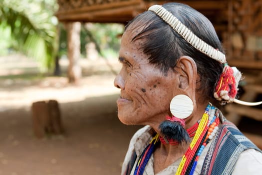 Portrait of old man with earrings