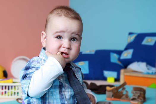 portrait years child in nurser with tie