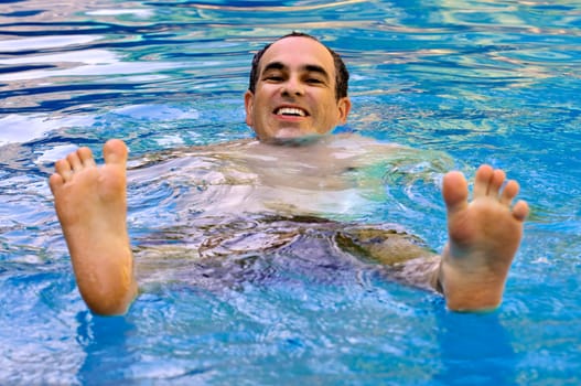 Man swimming in pool