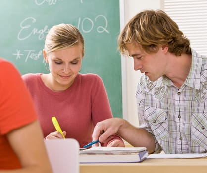 Students studying together in classroom