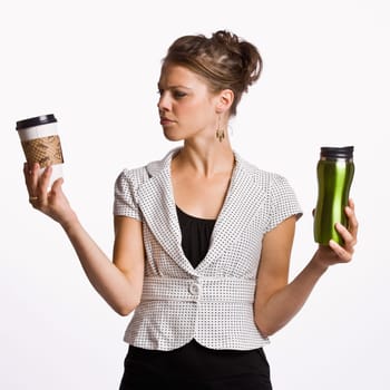 Businesswoman holding coffee cups