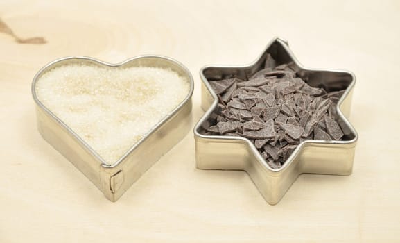 Cookie cutter with sugar and chocolate