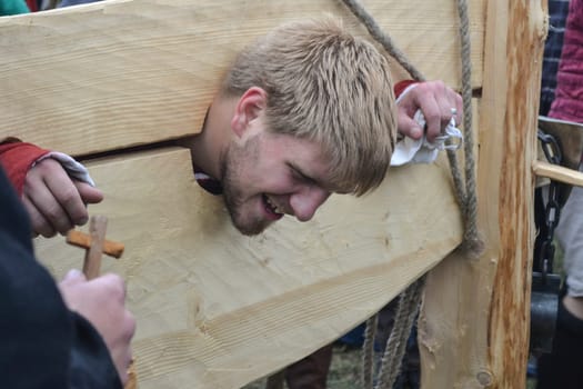 MOSCOW, RUSSIA - JUNE 22, 2013 : Park Kolomna. Festival of reconstruction Times and epochs. The staging of torture on the pillory