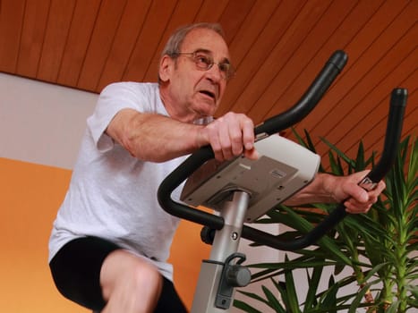 Senior on the exercise bike