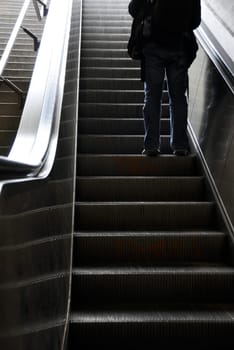 Man moving up with escalator