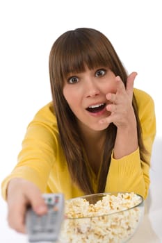 Female teenager watching television