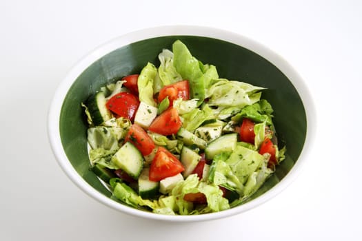 mixed green salad with tomato,cucumber and sheep's cheese