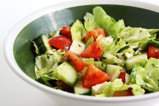 mixed green salad with tomato,cucumber and sheep's cheese