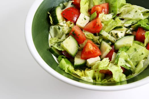 mixed green salad with tomato,cucumber and sheep's cheese