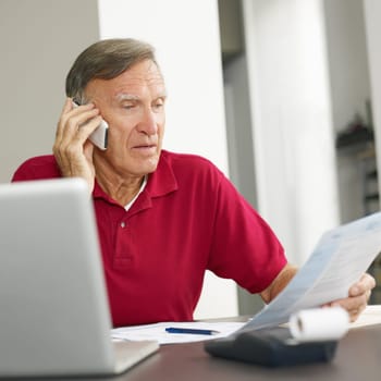 Senior man checking home finances. Copy space