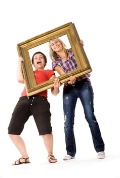 Young women posing with wooden frame