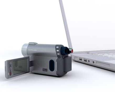3D handy cam next to a laptop isolated on white