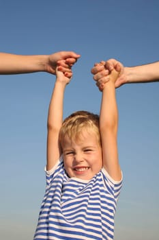 boy with parents hands