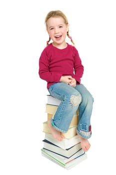 Child on a pile of books