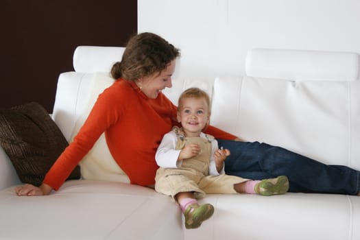 mother with baby on sofa