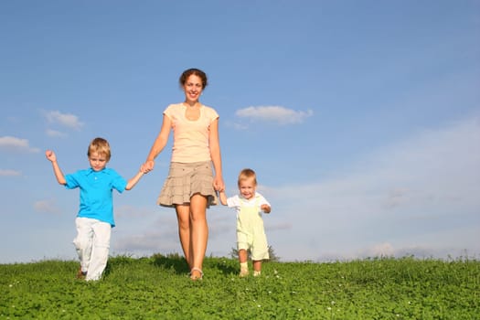 mother with children on meadow