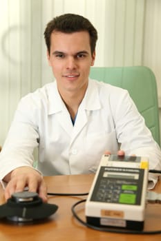 doctor with fat measurer