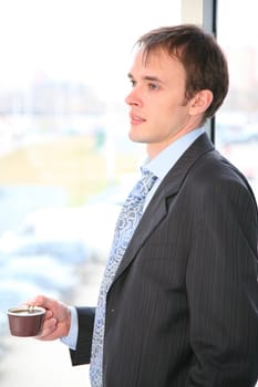 businessman with coffee and window