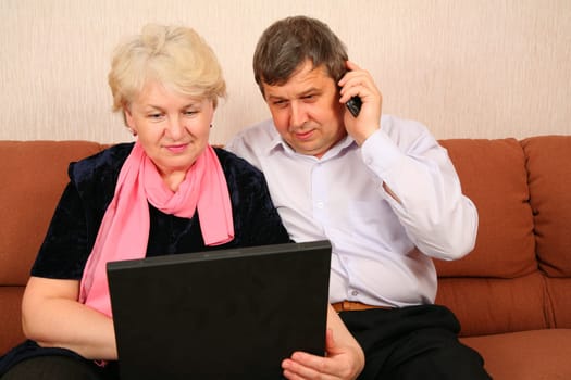 senior couple with notebook