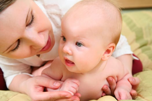 mother with baby in bed