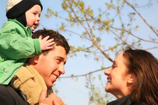 family with baby on shoulders 2
