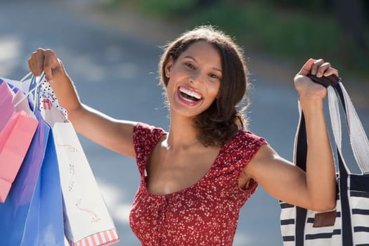 Young woman with shopping bags. Horizontally framed shot.