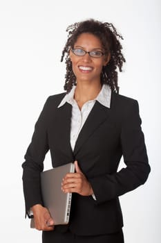 Young businesswoman holding laptop. Vertically framed shot.