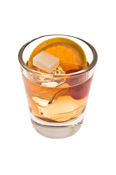 Old fashioned mixed drink with sugar cube on a white background