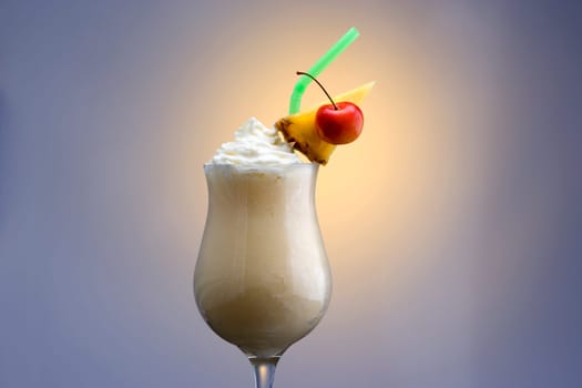 Pina Colada mixed drink on plain background with reflection