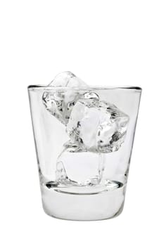Empty old fashioned glass with ice cubes on a white background on a white background
