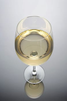 Glass of white wine on a white and black background