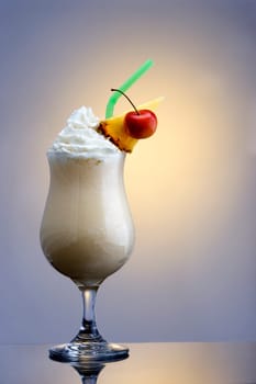 Pina Colada mixed drink on plain background with reflection