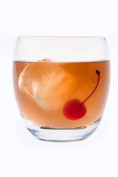 Whiskey Sour mixed drink with cherry garnish on white background