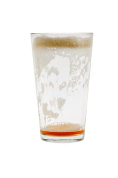Empty pint glass with foam on white background