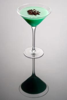 Grasshopper with shaved chocolate garnish on grey background
