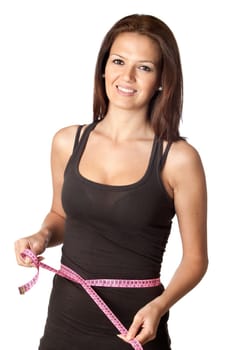Attractive girl with tape measure