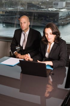 Businessman with assistant laughing
