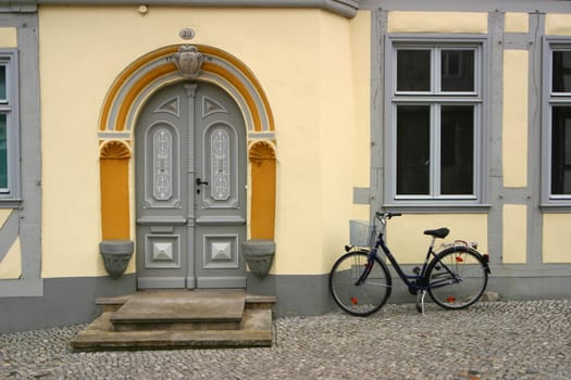 Bicycle in front of restored house